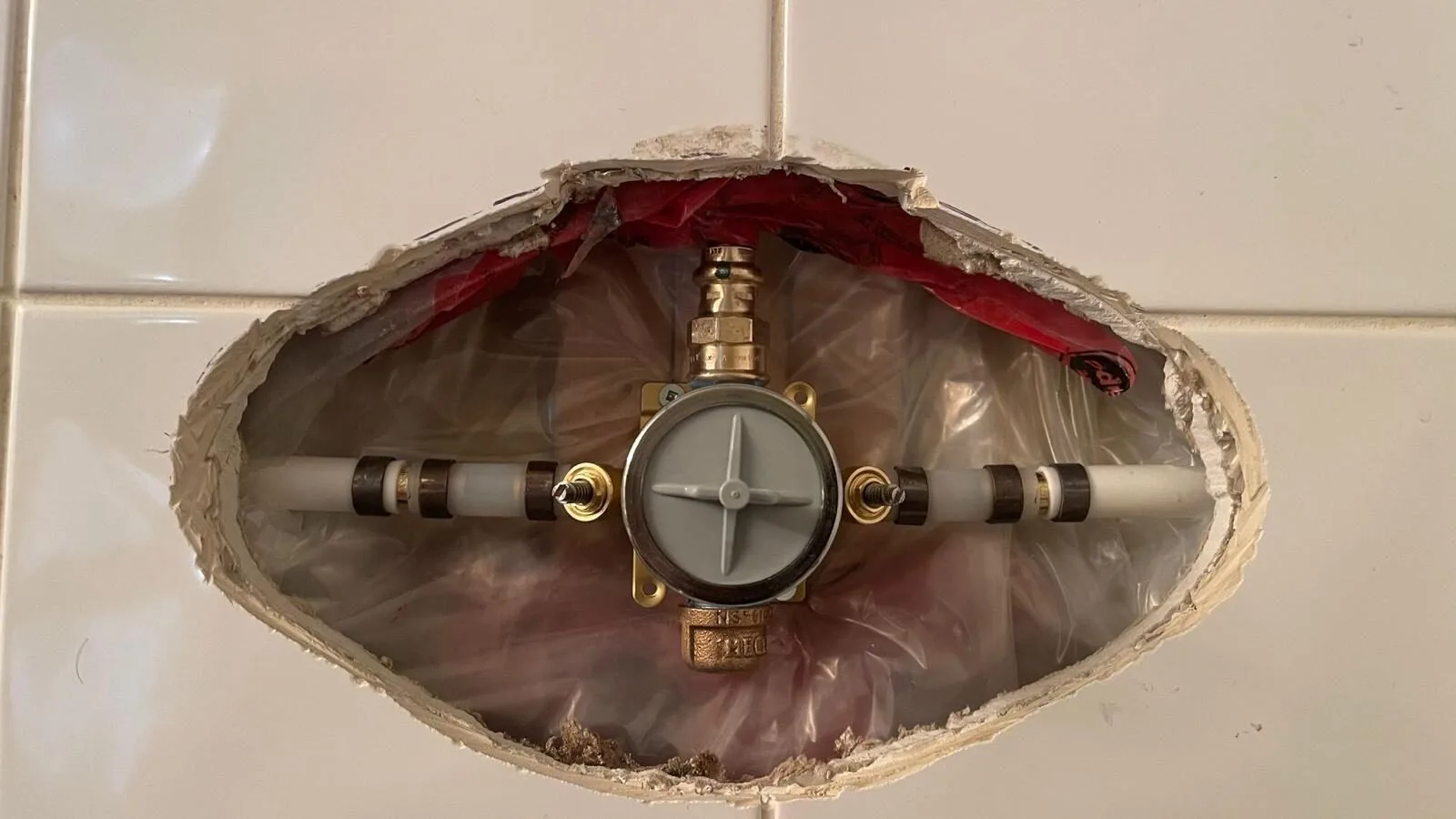 Completed shower valve renovation with renovation plate finish