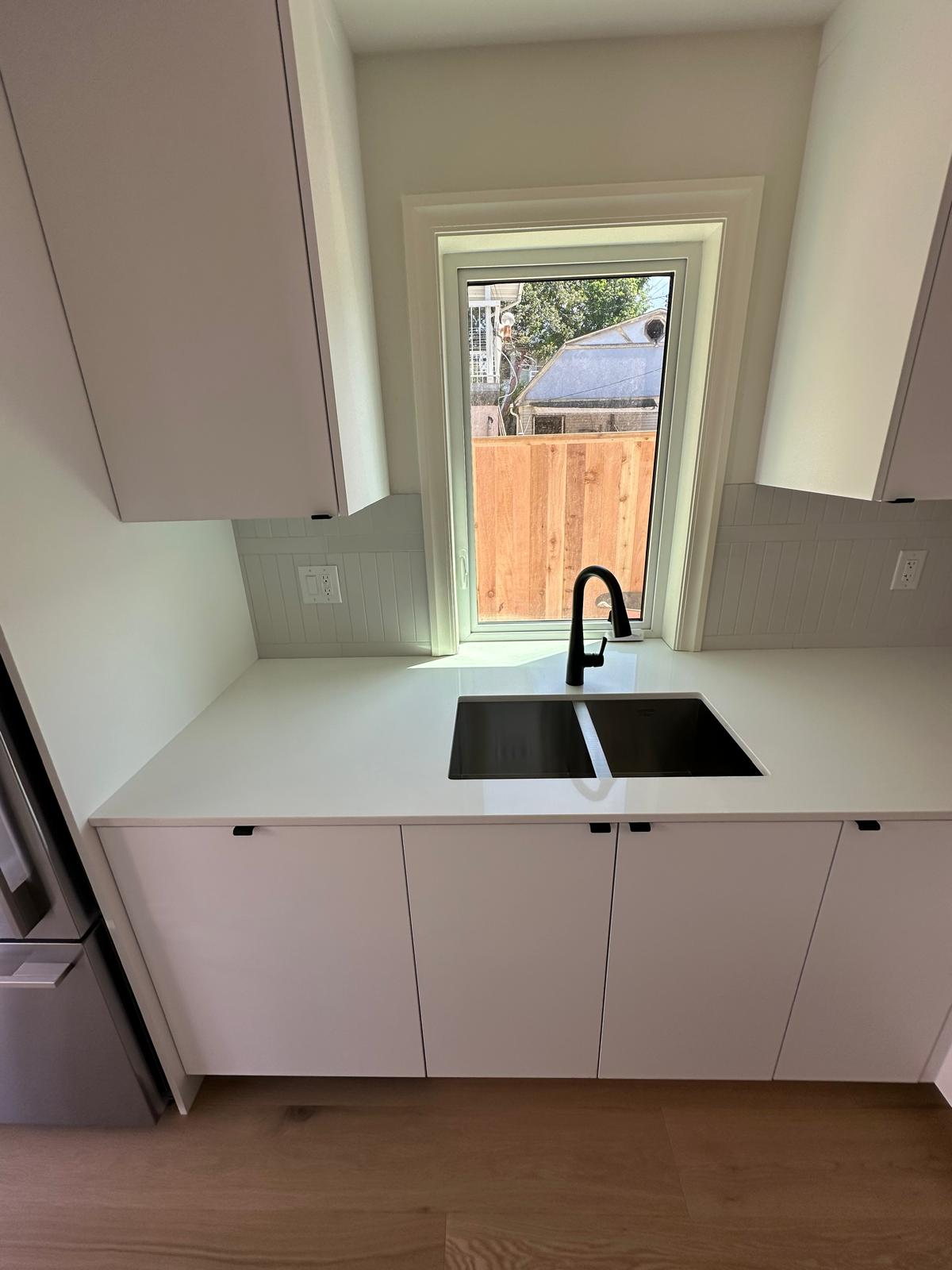 Kitchen Sink and dishwasher installation in a new laneway home in Vancouver, undermount kitchen sink and single hole faucet, panel ready dishwasher